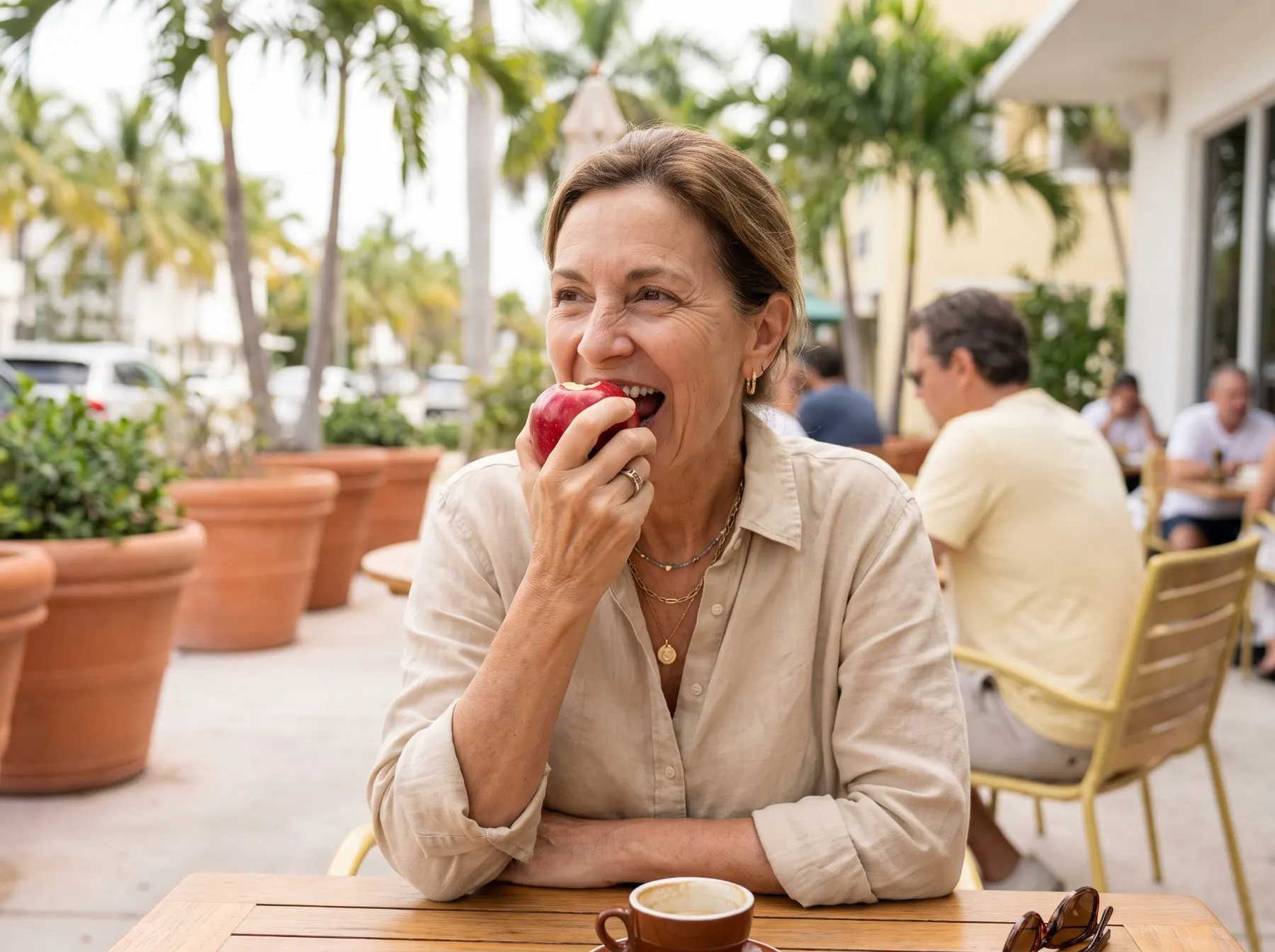 Woman biting an apple